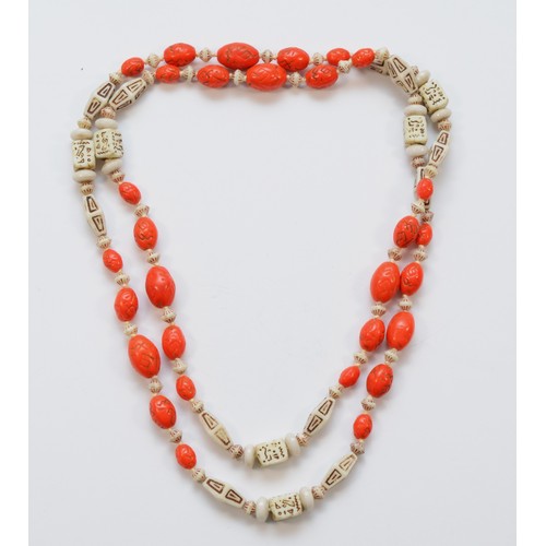 220 - Attributed to the Neiger Brothers, Czechoslovakia, an Art Deco orange and white glass bead necklace,... 