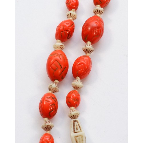 220 - Attributed to the Neiger Brothers, Czechoslovakia, an Art Deco orange and white glass bead necklace,... 