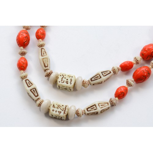 220 - Attributed to the Neiger Brothers, Czechoslovakia, an Art Deco orange and white glass bead necklace,... 