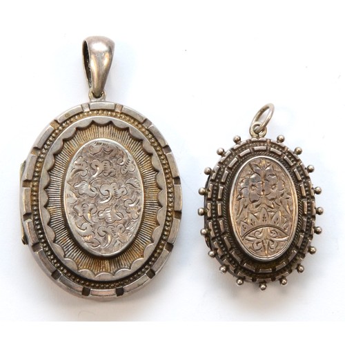 221 - Two unmarked Victorian silver lockets, the largest 53mm overall, 25gm