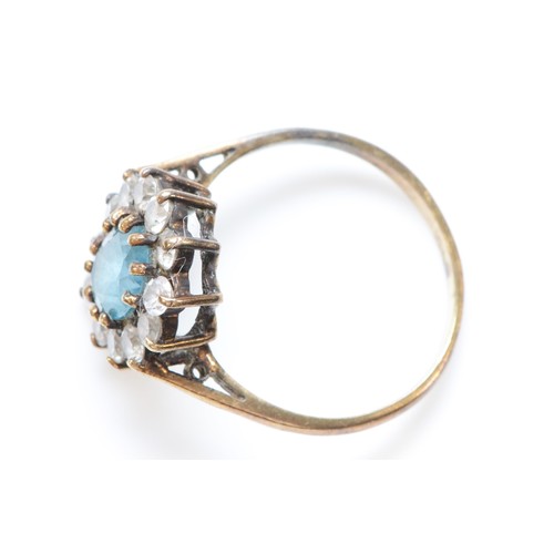 243 - A 9ct gold blue topaz and cubic zirconia set cluster ring, N, 2.4g