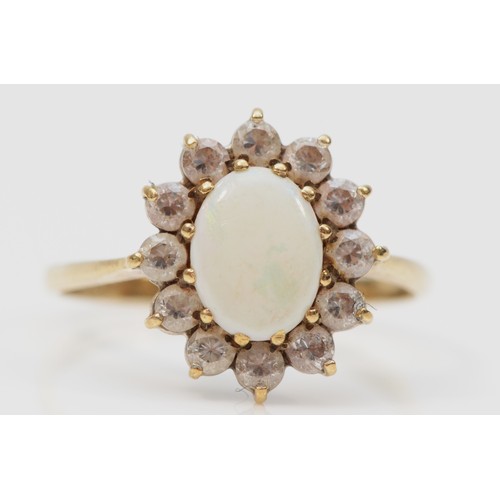 246 - A 9ct gold opal and cubic zirconia cluster ring, N, 1.7g