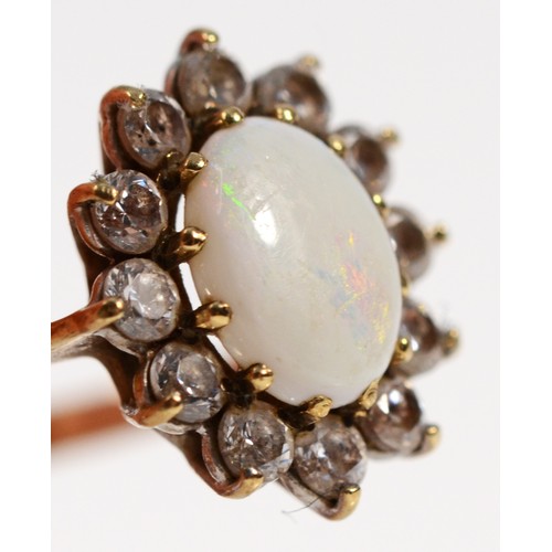 246 - A 9ct gold opal and cubic zirconia cluster ring, N, 1.7g