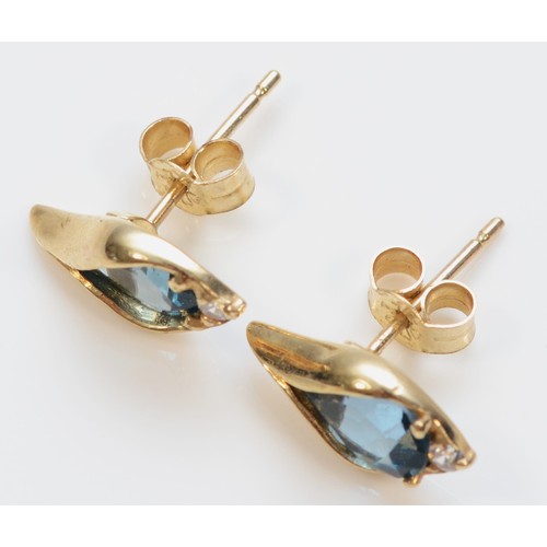 250 - A pair of 9ct gold blue topaz and cubic zirconia stud earrings, with scroll backs, 13mm length, 1.8g