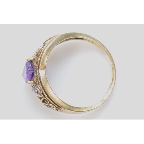 257 - A 9ct gold heart shaped amethyst and diamond patterned ring, N, 2.9g