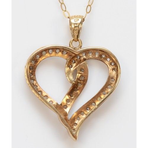 273 - A 9ct gold diamond heart shaped pendant with necklace, 20mm heart drop length, 2.1g