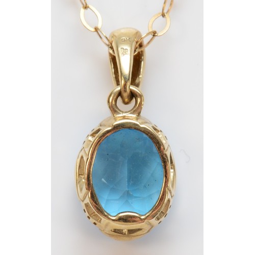 274 - A 9ct gold oval cut blue topaz pendant with necklace, 12mm x 10mm topaz, 4.1g