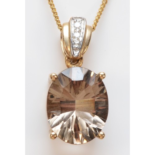 277 - A 9ct gold oval cut smokey quartz and diamond pendant with necklace, 17mm pendant length, 3g