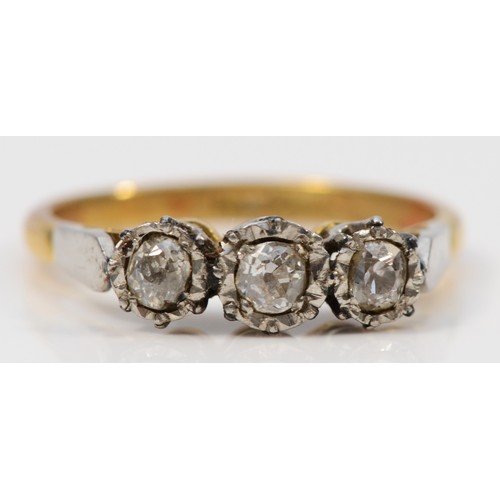 283 - An 18ct gold and platinum vintage diamond three stone ring, N, 3g