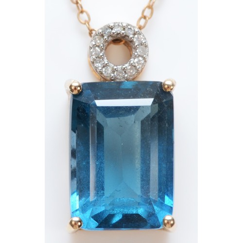 291 - A 9ct gold blue topaz and diamond pendant with necklace, 14mm x 10mm topaz, 4.9g