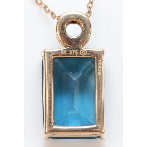 291 - A 9ct gold blue topaz and diamond pendant with necklace, 14mm x 10mm topaz, 4.9g