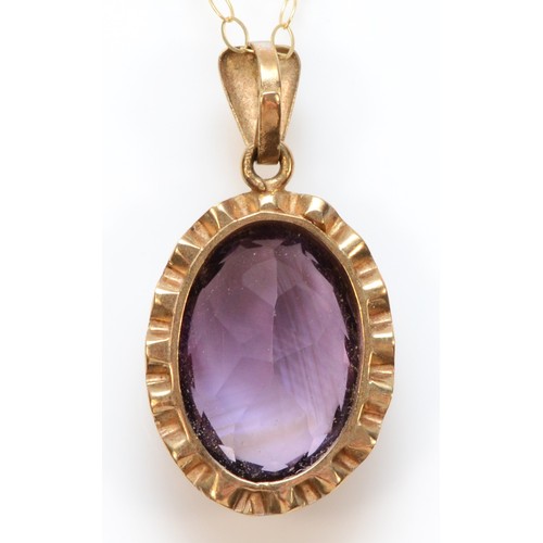 292 - A 9ct gold oval cut amethyst pendant, with necklace, 13mm x 9mm amethyst, 2.6g