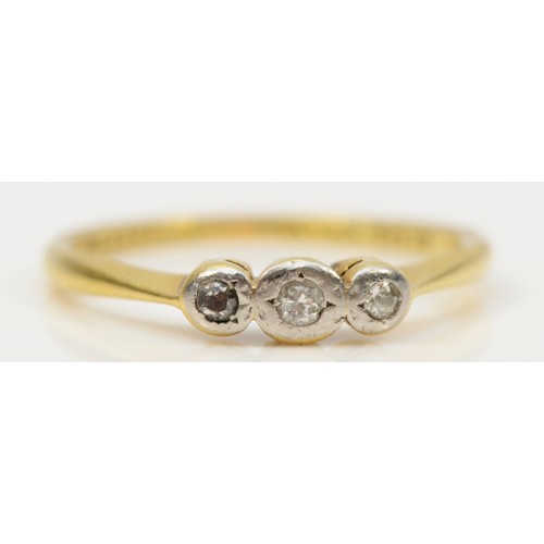 293 - An 18ct gold and platinum vintage diamond three stone ring, M, 2g