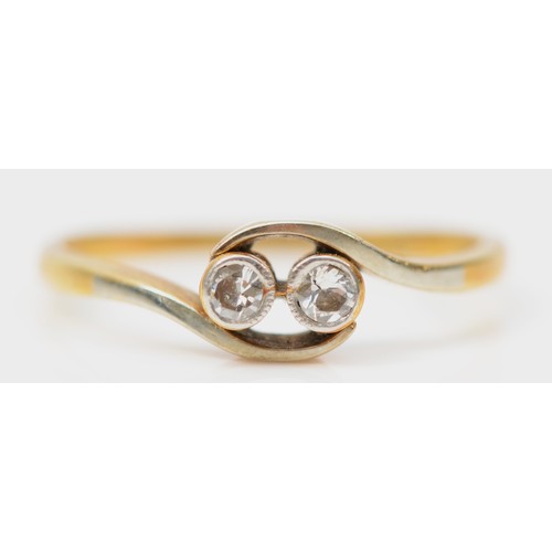 299 - An 18ct gold and platinum antique diamond crossover ring with a milgrain edge, N 1/2, 2.1g