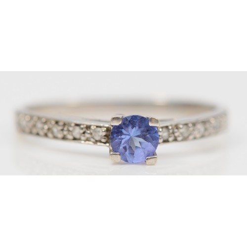 304 - A 9ct white gold tanzanite and white gemstone dress ring, N, 1.5g