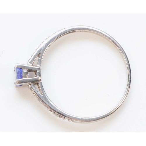 304 - A 9ct white gold tanzanite and white gemstone dress ring, N, 1.5g