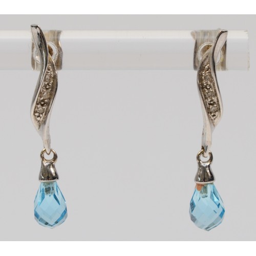 308 - A pair of 9ct white gold diamond and faceted blue topaz drop earrings, 25mm drop, 1.8g