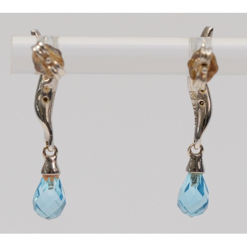 308 - A pair of 9ct white gold diamond and faceted blue topaz drop earrings, 25mm drop, 1.8g