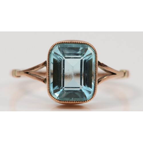 310 - A 9ct gold milgrain edge aquamarine paste dress ring, P, 1.8g