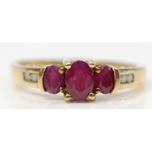 315 - A 9ct gold oval cut ruby and diamond dress ring, O 1/2, 2g