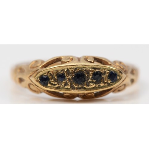 325 - A 9ct gold vintage sapphire ring with a scroll pattern gallery, L, 1.5g