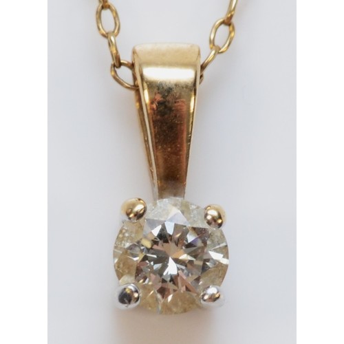 329 - A 9ct gold diamond solitaire pendant with chain, 1.5g