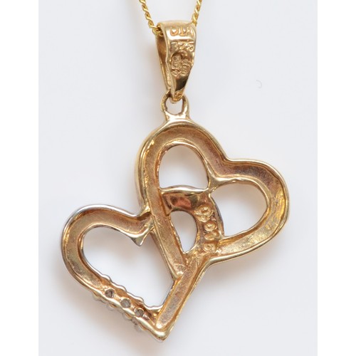 333 - A 9ct gold diamond double heart shaped pendant, with chain, 14mm across pendant, 1.7g