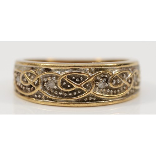 335 - A 9ct gold diamond patterned half eternity ring, stated 0.05 carat diamond weight, M, 3.7g