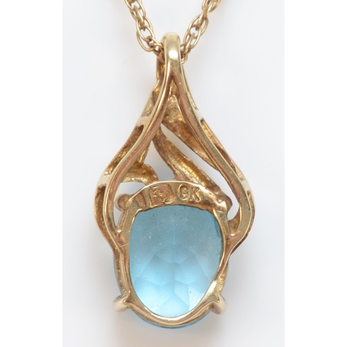 341 - A 9ct gold vintage oval cut blue topaz pendant with chain, total pendant length is 17mm, 2.1g