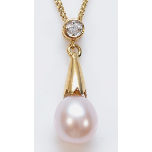 343 - A 9ct gold cultured pearl and diamond pendant, with chain, 18mm pendant length, 6mm pearl, chain 42c... 