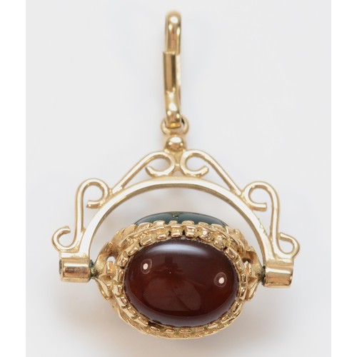 353 - A 9ct gold vintage carnelian, onyx and bloodstone spinning fob, 3.2g