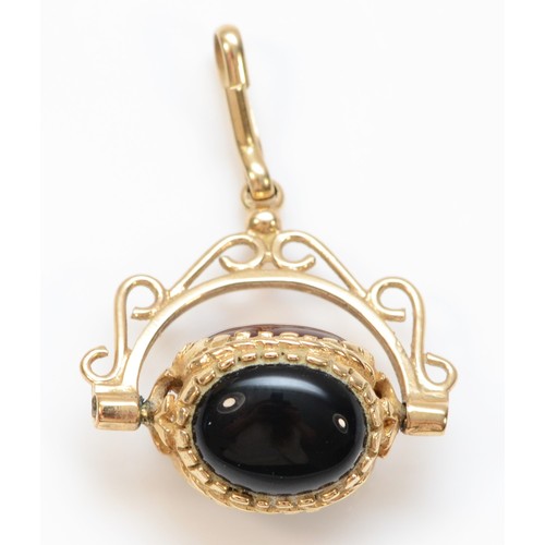 353 - A 9ct gold vintage carnelian, onyx and bloodstone spinning fob, 3.2g