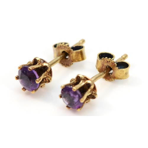 372 - A pair of 9ct gold vintage amethyst stud earrings with scroll backs, 0.9g