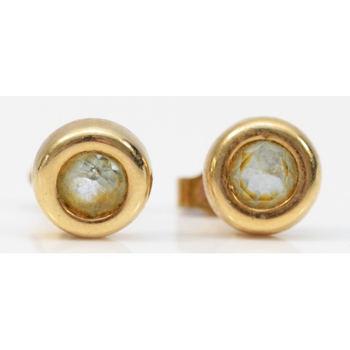 377 - A pair of 9ct gold bezel set blue topaz stud earrings with scroll backs, 6mm diameter, 1.6g