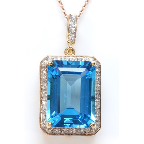 381 - A 9ct gold blue topaz and diamond pendant, with chain, 18mm x 12mm topaz, 8.8g