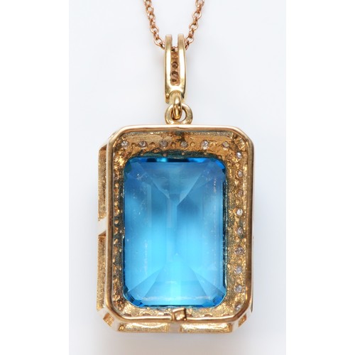 381 - A 9ct gold blue topaz and diamond pendant, with chain, 18mm x 12mm topaz, 8.8g