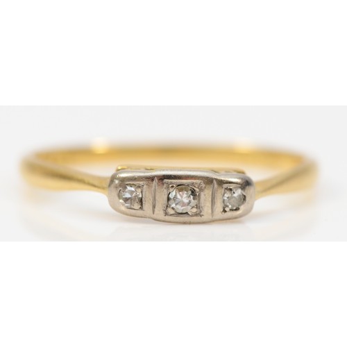 382 - An 18ct gold and platinum art deco diamond three stone ring, L, 1.3g