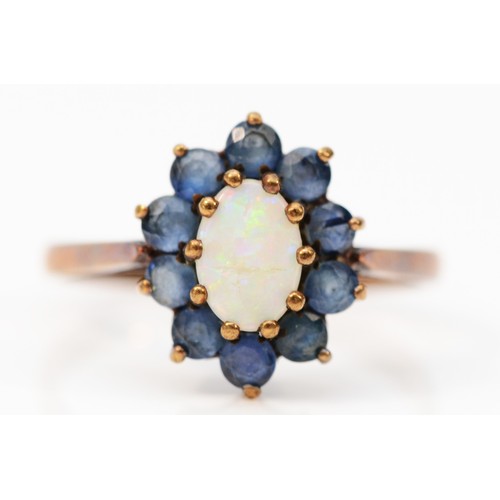 390 - A 9ct gold vintage opal and sapphire cluster ring, claw set, London 1972, N, 2.3g