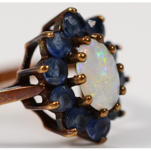 390 - A 9ct gold vintage opal and sapphire cluster ring, claw set, London 1972, N, 2.3g