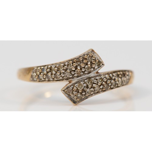 398 - A 9ct gold pave set diamond crossover ring, P, 1.8g