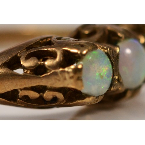 402 - A 9ct gold vintage opal three stone ring with patterned gallery, N, 1.8g