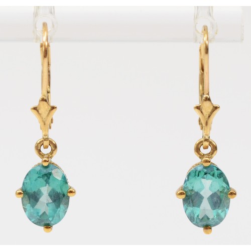 403 - A pair of 9ct gold oval cut blue gemstone drop earrings with lever backs, 8mm drop, 2.2g