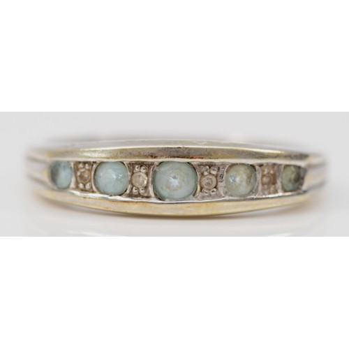 405 - A 9ct white gold blue topaz and diamond half eternity ring, R, 2.6g