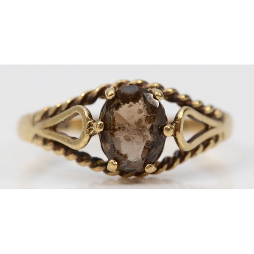 409 - A 9ct gold vintage oval cut smokey quartz dress ring, Edinburgh 1981, R, 2.2g