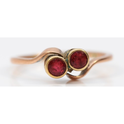 A Victorian part duty marked gold ruby paste crossover ring, bezel set ...