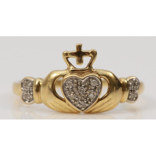 561 - A 9ct gold diamond Irish Claddagh ring, T, 1.6g