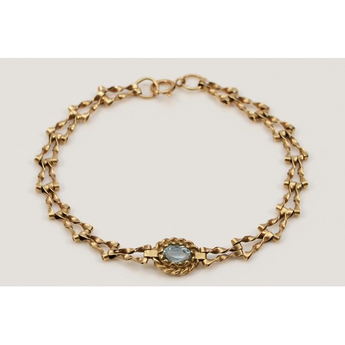 562 - A 9ct gold blue topaz bracelet, 17cm, 2.9g