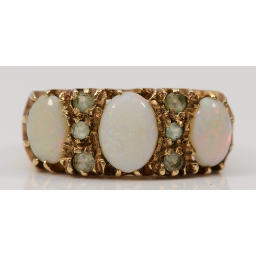 567 - A 9ct gold vintage opal and white gemstone dress ring, London 1973, O 1/2, 4.4g