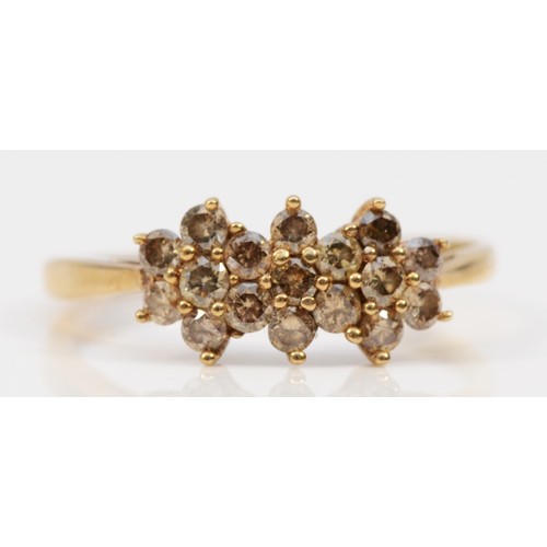 568 - A 9ct gold diamond cluster ring, claw set, N 1/2, 1.5g