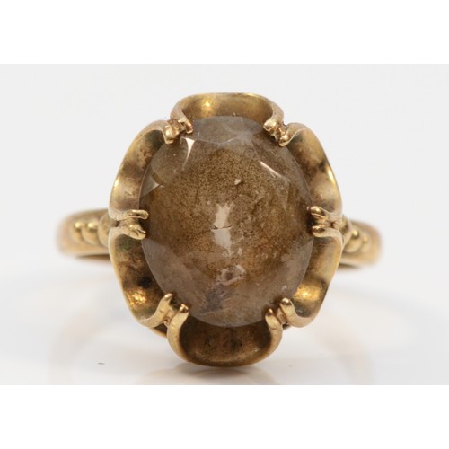 570 - A 9ct gold vintage oval cut smokey quartz dress ring, J, 3.2g